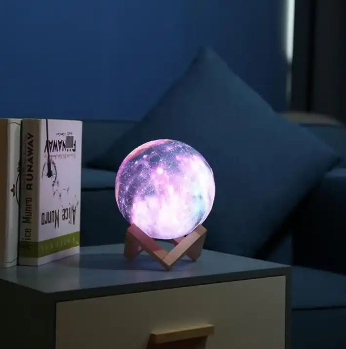 Galaxy Moon Lamp on a bedside table